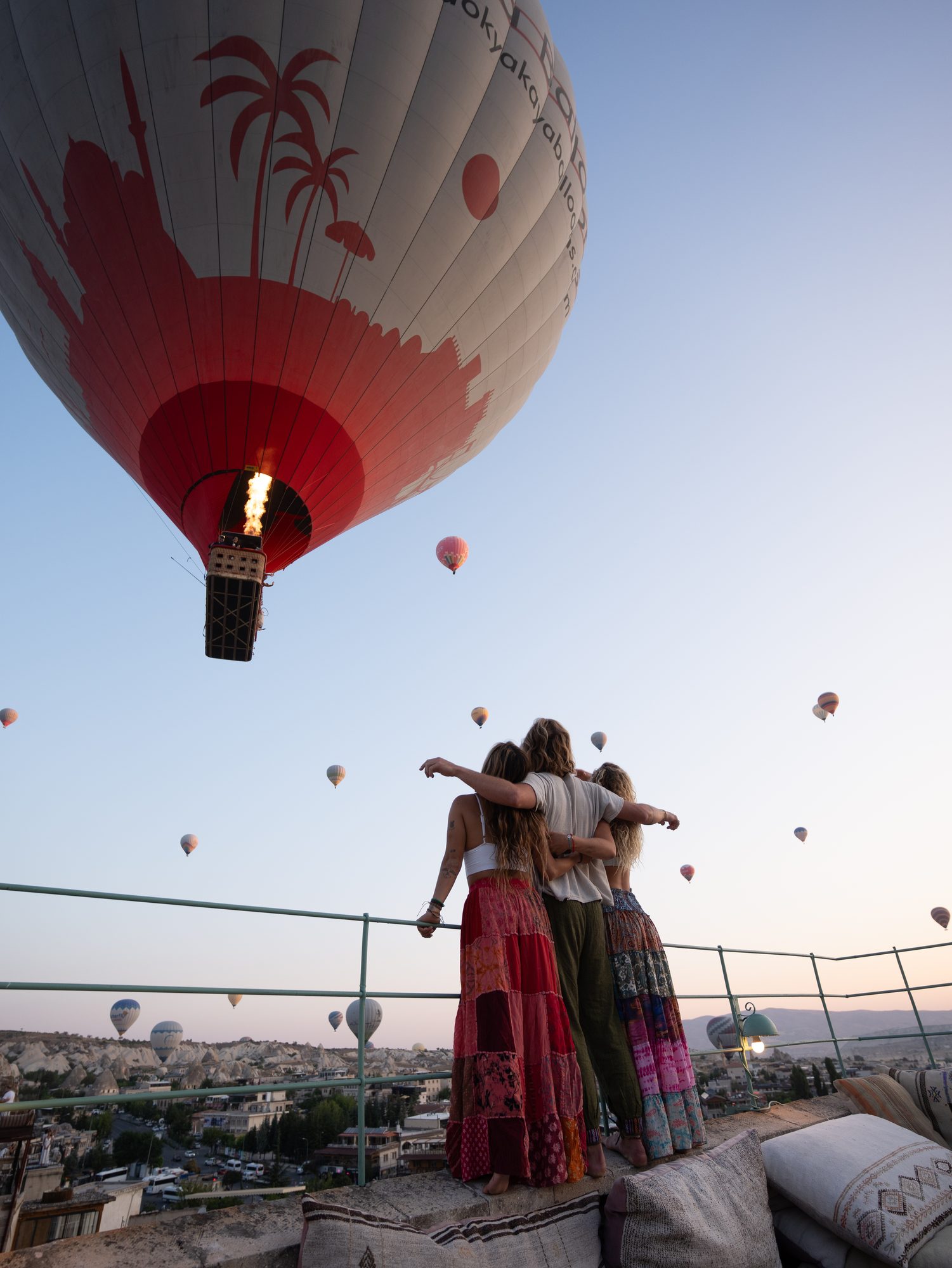 Jaro and friends watching hot air balloons rise over Cappadocia at sunrise