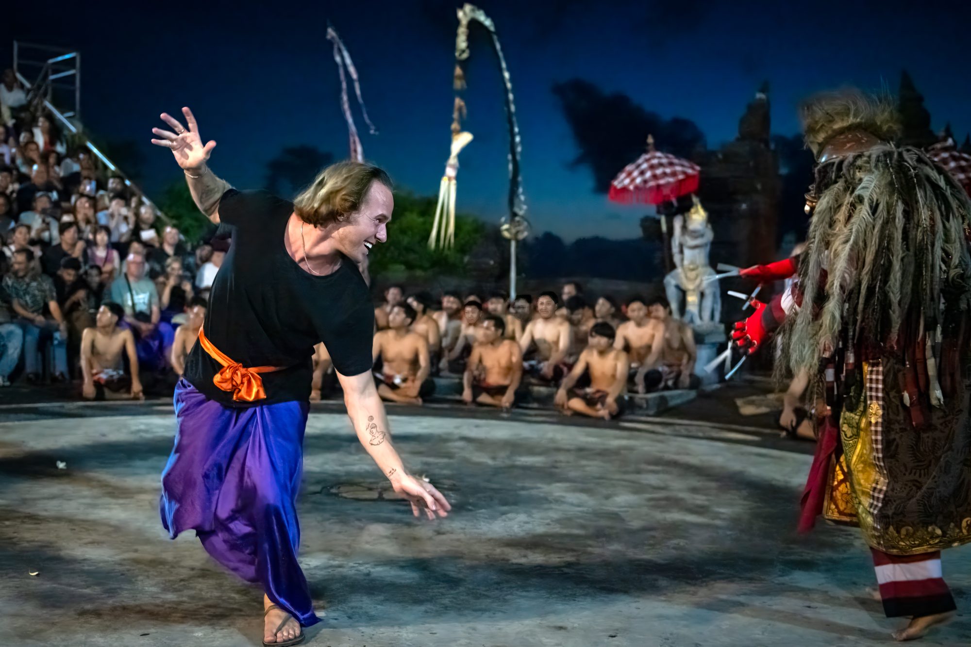 Jaro performing in a traditional Balinese Kecak fire dance at night