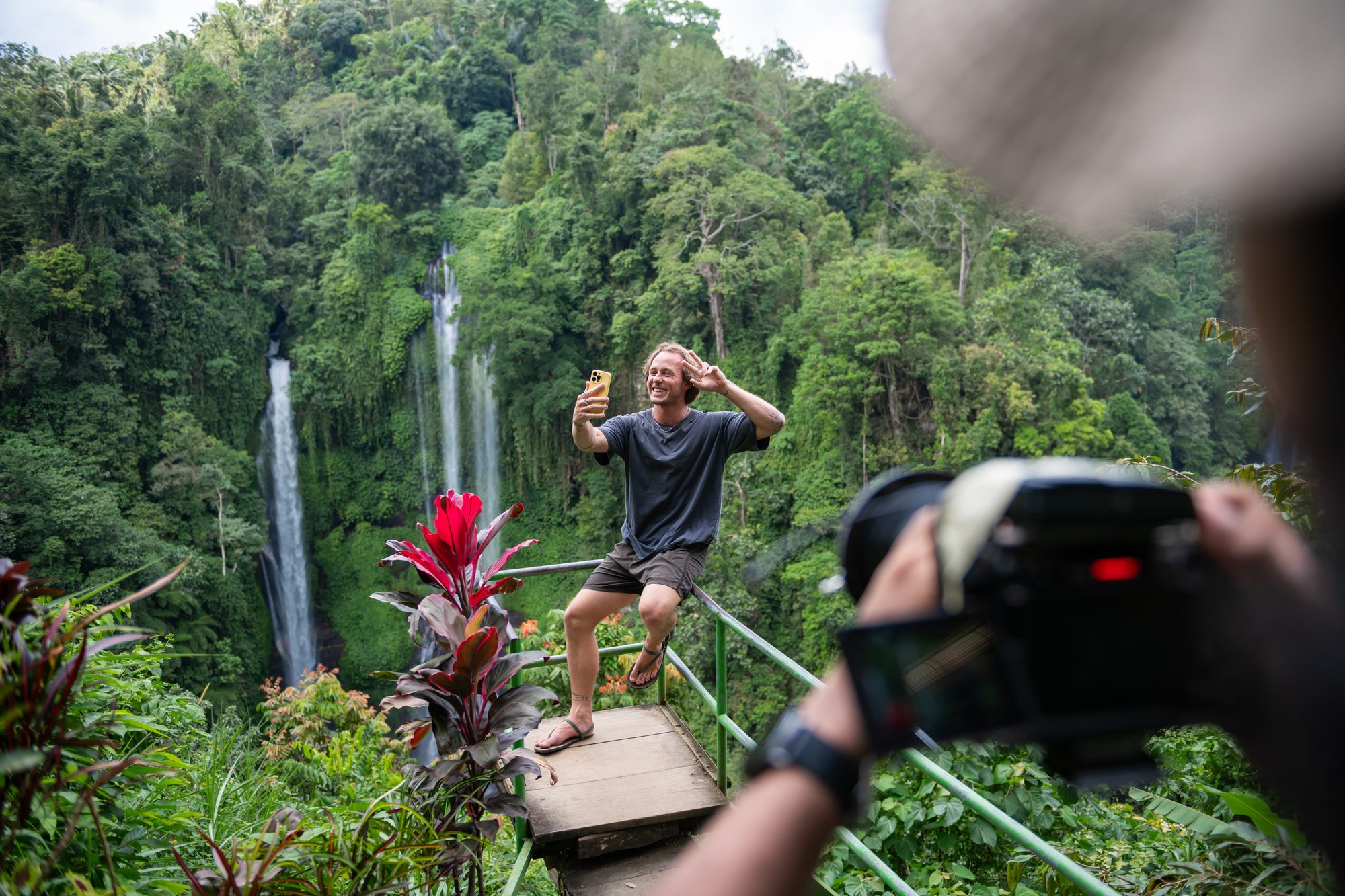 Jaro filming a selfie video in front of a waterfall