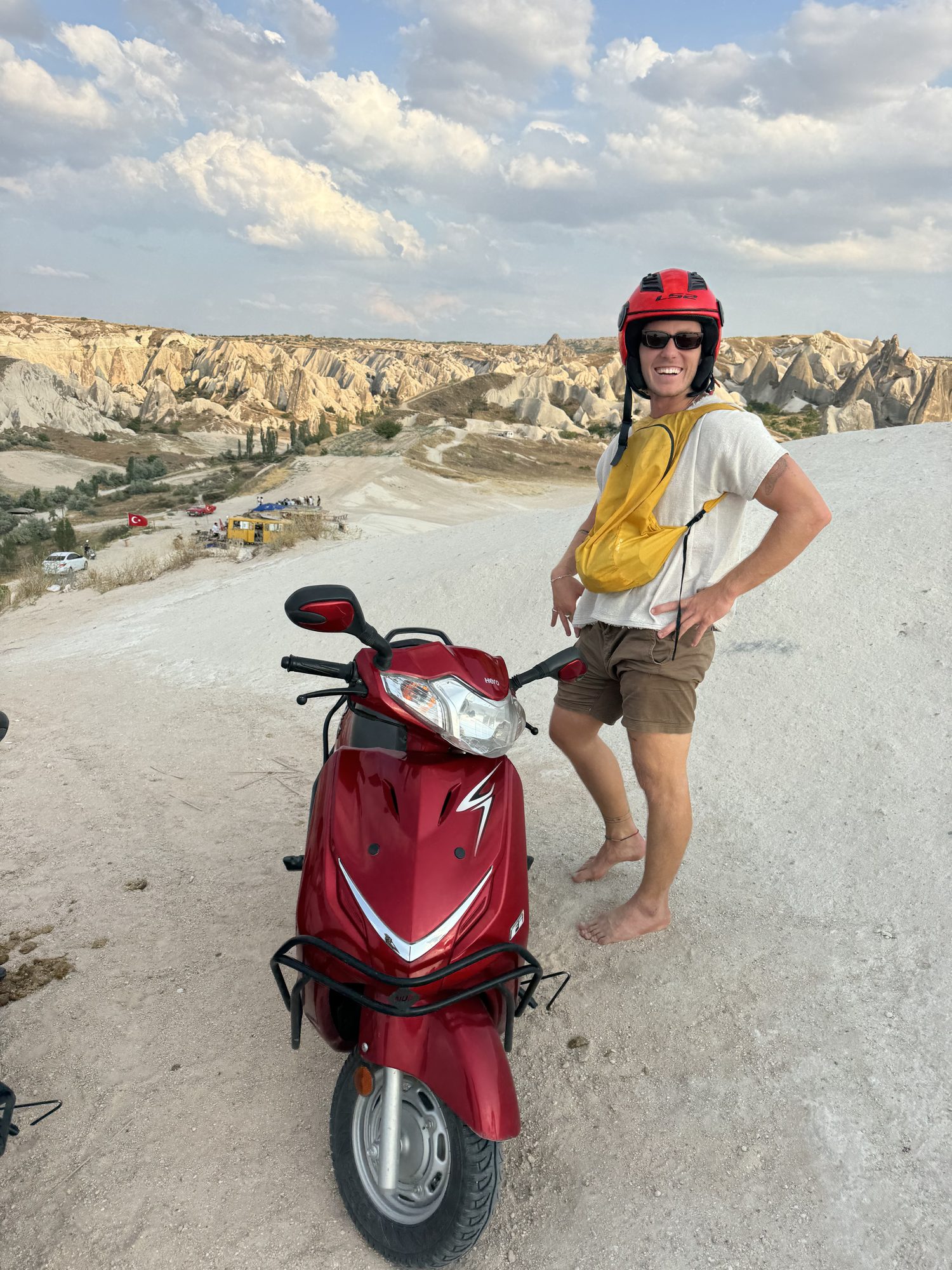 Jaro on a scooter in the Cappadocia valleys, geared up for the hot air balloon campaign shoot